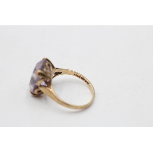 142 - A hallmarked London 9ct gold amethyst cocktail ring, size M½ - approx. gross weight 3.1 grams