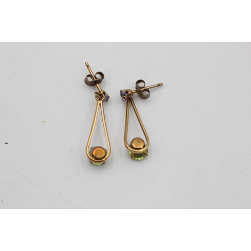 144 - A pair of 9ct gold amethyst and peridot drop earrings - approx. gross weight 1.2 grams