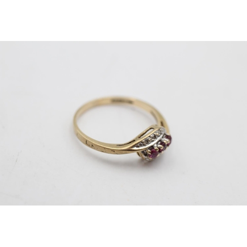 145 - A 9ct gold vintage ruby and diamond bypass ring, size L - approx. gross weight 1.4 grams