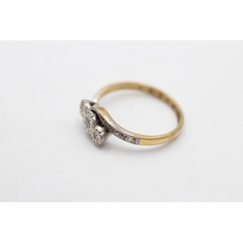 149 - An 18ct gold and platinum diamond trilogy bypass ring, size L - approx. gross weight 2.5 grams