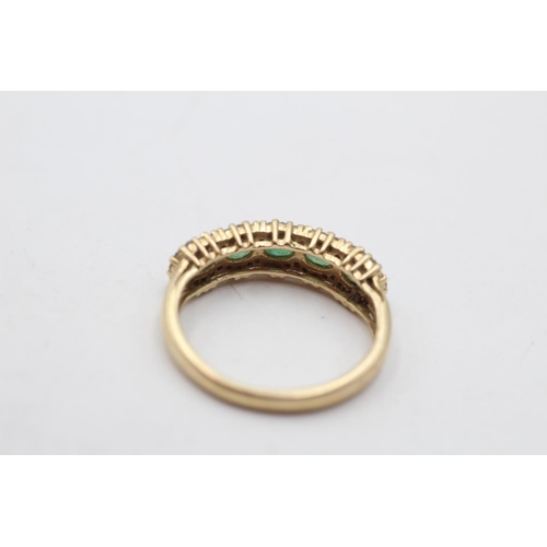 153 - A 14ct gold emerald and diamond pave ring, size N - approx. gross weight 2.6 grams