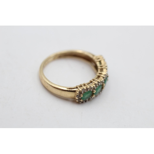 153 - A 14ct gold emerald and diamond pave ring, size N - approx. gross weight 2.6 grams