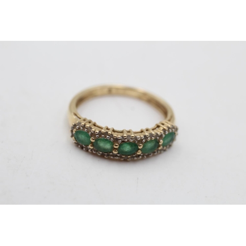 153 - A 14ct gold emerald and diamond pave ring, size N - approx. gross weight 2.6 grams