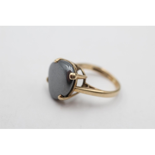 162 - A 9ct gold obscure shaped hematite ring, size G½ - approx. gross weight 4.2 grams