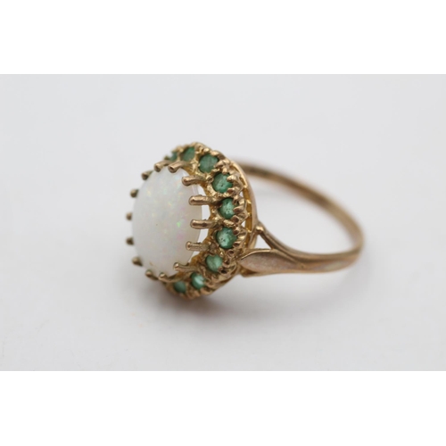 169 - A hallmarked London 9ct gold opal and emerald halo cocktail ring, size Q½ - approx. gross weight 4.2... 