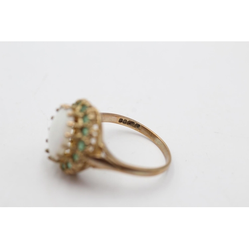 169 - A hallmarked London 9ct gold opal and emerald halo cocktail ring, size Q½ - approx. gross weight 4.2... 