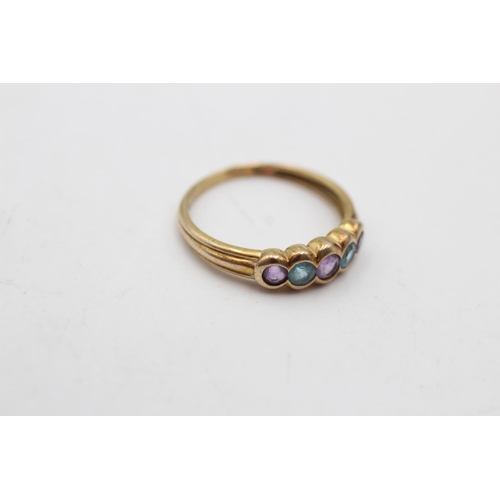 172 - A 9ct gold amethyst and topaz five stone ring, size K½  - approx. gross weight 1.6 grams