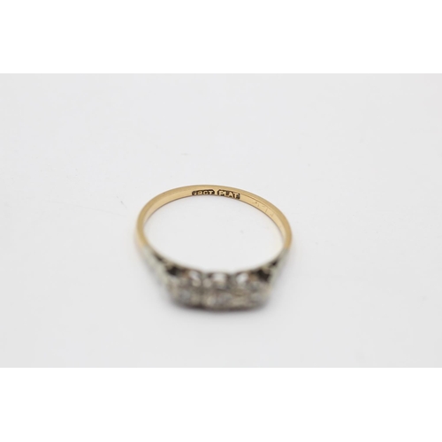 173 - An 18ct gold and platinum diamond trilogy ring, size L - approx. gross weight 1.6 grams