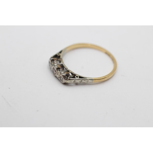 173 - An 18ct gold and platinum diamond trilogy ring, size L - approx. gross weight 1.6 grams