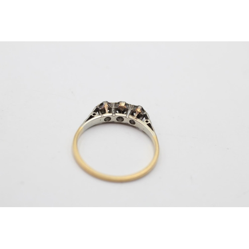 173 - An 18ct gold and platinum diamond trilogy ring, size L - approx. gross weight 1.6 grams