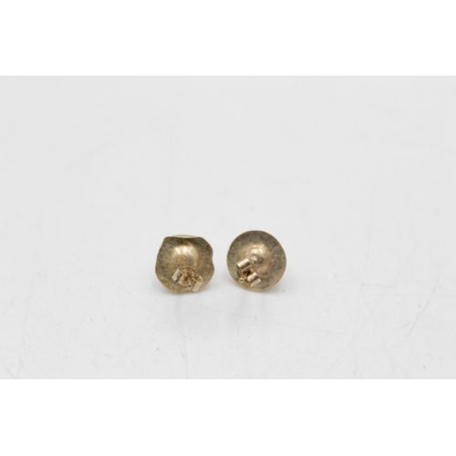 175 - Three pairs of 9ct gold gemstone earrings to include onyx studs, reconstituted turquoise drop etc. -... 