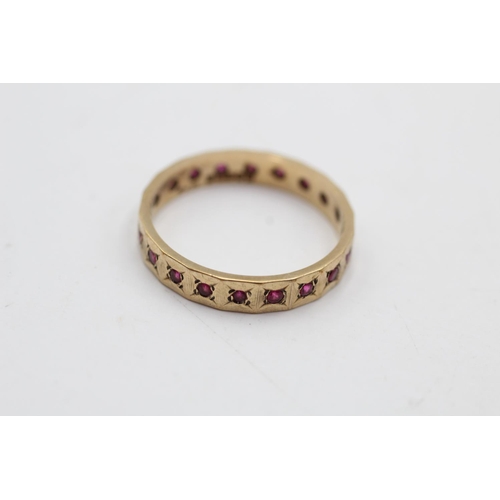 19 - A 9ct gold ruby eternity ring, size S - approx. gross weight 2.8 grams