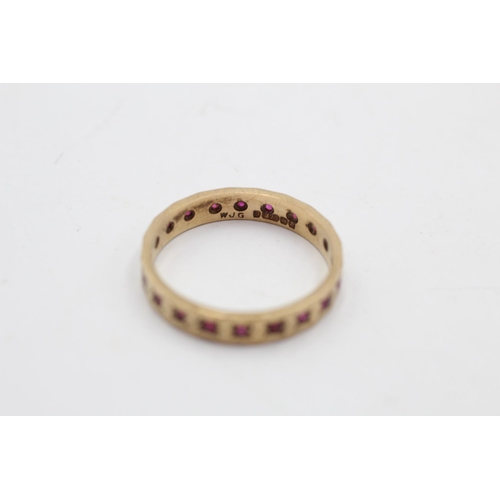 19 - A 9ct gold ruby eternity ring, size S - approx. gross weight 2.8 grams