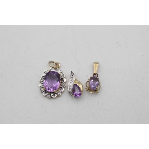 2 - Three 9ct gold amethyst pendants to include diamonds - approx. gross weight 2.3 grams