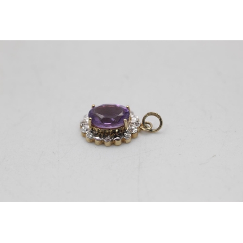 2 - Three 9ct gold amethyst pendants to include diamonds - approx. gross weight 2.3 grams