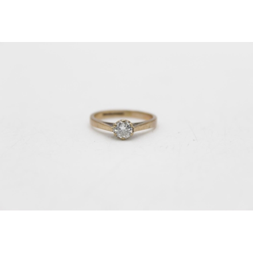 25 - A 9ct gold diamond cathedral set solitaire ring, size J½ - approx. gross weight 1.9 grams