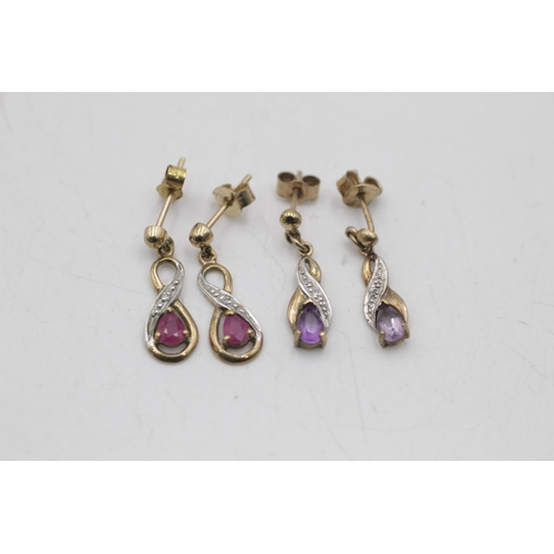 26 - Two pairs of 9ct gold gemstone and diamond infinity knot drop earrings, one ruby and one amethyst - ... 