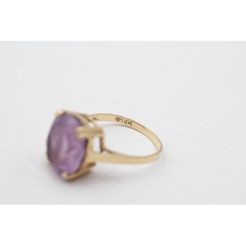 29 - A 14ct gold amethyst solitaire ring, size P½ - approx. gross weight 4.4 grams