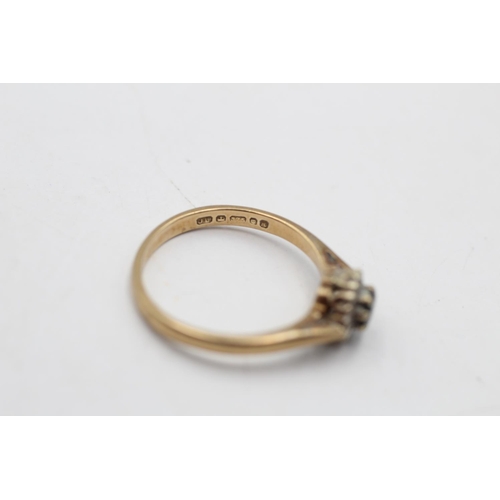 31 - A hallmarked London 9ct gold diamond and sapphire dress ring, size L½ - approx. gross weight 2 grams