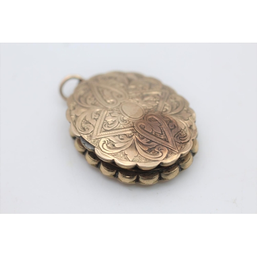 33 - An antique 7ct gold front and back ornate design locket - approx. gross weight 5.9 grams