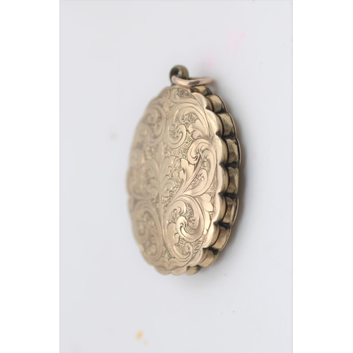 33 - An antique 7ct gold front and back ornate design locket - approx. gross weight 5.9 grams