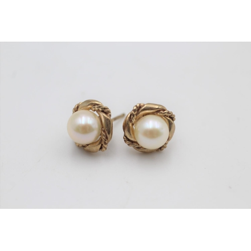 37 - A pair of 9ct gold cultured pearl stud earrings - approx. gross weight 2.3 grams