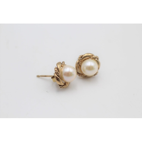 37 - A pair of 9ct gold cultured pearl stud earrings - approx. gross weight 2.3 grams