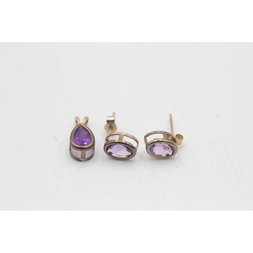 39 - A 9ct gold amethyst earrings and pendant set - approx. gross weight 1.1 grams