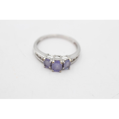 4 - A 9ct white gold tanzanite and diamond shoulder trilogy ring, size L - approx. gross weight 1.8 gram... 