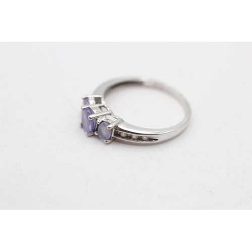 4 - A 9ct white gold tanzanite and diamond shoulder trilogy ring, size L - approx. gross weight 1.8 gram... 