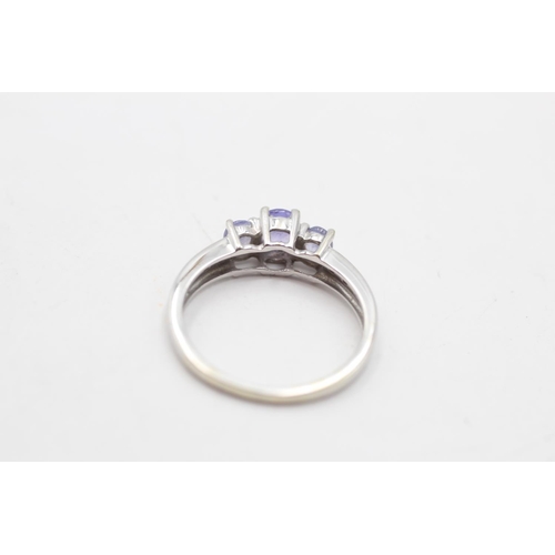 4 - A 9ct white gold tanzanite and diamond shoulder trilogy ring, size L - approx. gross weight 1.8 gram... 