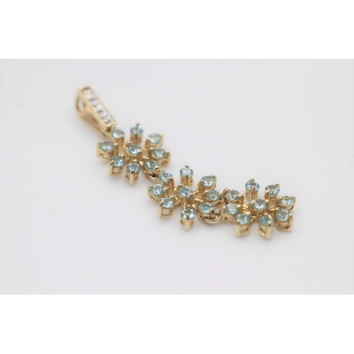 43 - A 9ct gold diamond and blue zircon floral drop pendant - approx. gross weight 2.1 grams