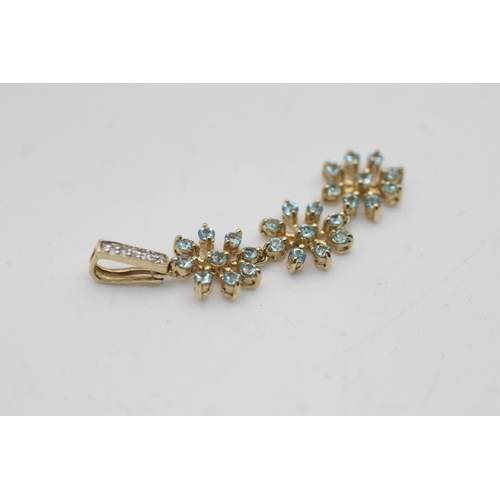 43 - A 9ct gold diamond and blue zircon floral drop pendant - approx. gross weight 2.1 grams