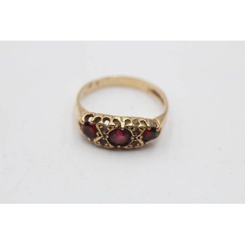 47 - A 9ct gold garnet and clear gemstone gypsy ring, size M - approx. gross weight 2.1 grams