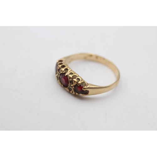 47 - A 9ct gold garnet and clear gemstone gypsy ring, size M - approx. gross weight 2.1 grams