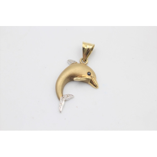 58 - A 14ct gold clear gemstone and sapphire set dolphin pendant - approx. gross weight 4 grams