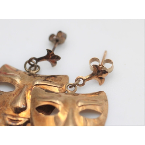 70 - A pair of 9ct gold theatre mask design drop earrings - approx. gross weight 1 gram