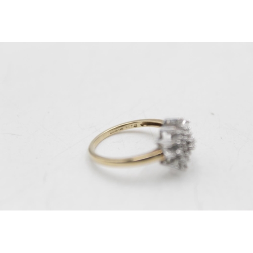 73 - A hallmarked Birmingham 9ct gold diamond starburst ring, size Q - approx. gross weight 3 grams