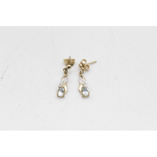 74 - Two pairs of 9ct gold gemstone and diamond drop earrings, one aquamarine and one sapphire - approx. ... 