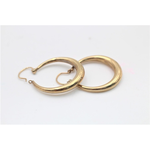 76 - A pair of hallmarked Birmingham 9ct gold hoop earrings - approx. gross weight 2.2 grams