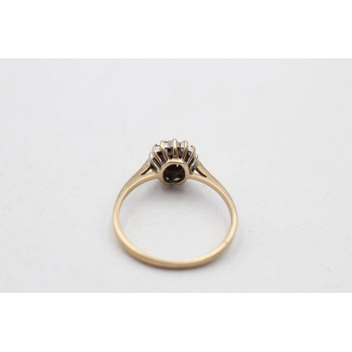 92 - A 9ct gold diamond and sapphire dress ring, size M - approx. gross weight 1.5 grams