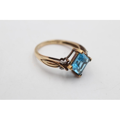 93 - A hallmarked London 9ct gold topaz and diamond shoulder ring, size P - approx. gross weight 3.2 gram... 