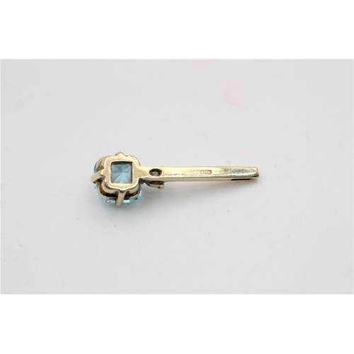 96 - A 9ct gold diamond and topaz drop pendant - approx. gross weight 1 gram