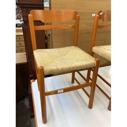 1042 - A mid 20th century rectangular dining table with white laminate top, orange finish and four matching... 