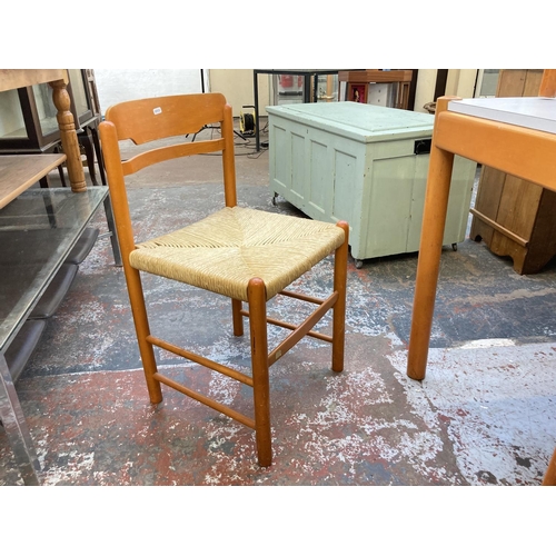 1042 - A mid 20th century rectangular dining table with white laminate top, orange finish and four matching... 