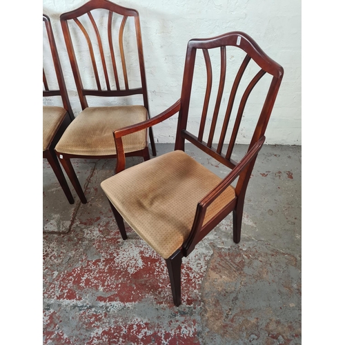 1145 - A set of four mahogany dining chairs with beige upholstery