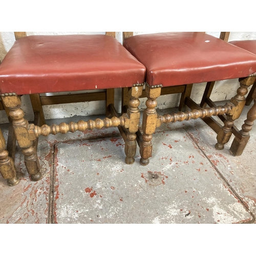 1146 - Five mid 20th century oak and red vinyl brass studded dining chairs