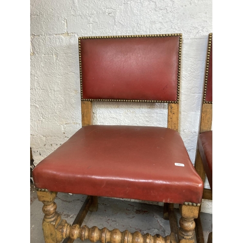 1146 - Five mid 20th century oak and red vinyl brass studded dining chairs