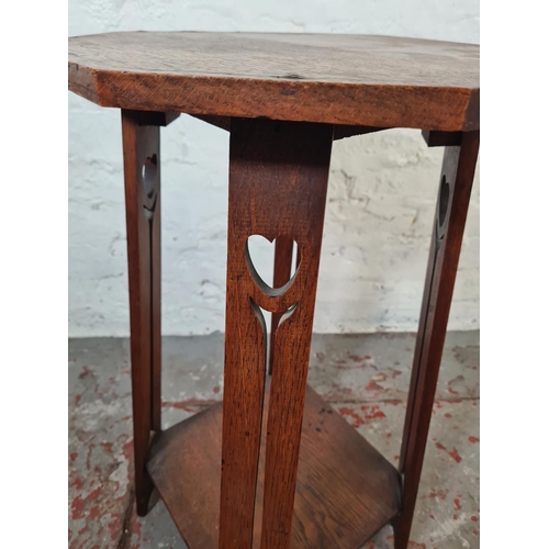 1003 - An Arts and Crafts inlaid oak octagonal top two tier side table - approx. 68cm high x 36cm wide x 38... 