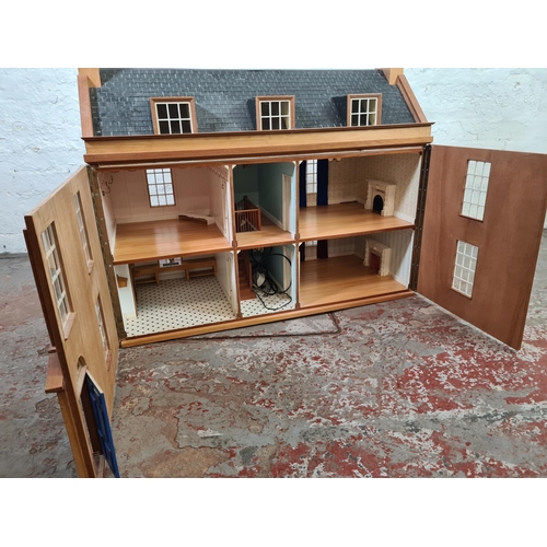 1007A - A handmade wooden doll's house - approx. 85cm high x 92xm wide x 43cm deep